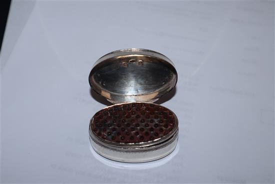 A George III engraved silver oval nutmeg grater by Joseph Wilmore, Birmingham, 1800, (grille hinge damaged), 46mm.
